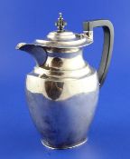 A George V silver hot water pot, of rounded rectangular form, Ollivant & Botsford, Sheffield, 1923,