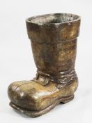 A Continental walnut shop display or jardiniere stand, modelled as a boot, with a square buckle to