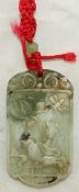 A Chinese green and white bowenite pendant plaque, carved in relief with lotus and an insect,4.3cm.