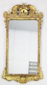 A mid 18th century carved giltwood wall mirror, with acanthus and shell carved decoration, 3ft 7.