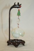 A Chinese jadeite peach and finger citron hanging pendant, the white stone with slight emerald