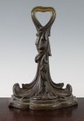 A late 19th century bronze doorporter, modelled as entwined acanthus leaves, on a stepped plinth