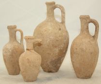 Four graduated Cypriot pottery jugs, c.3rd century BC, each of oviform with a looped handle applied