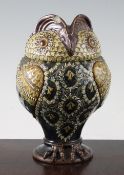 A rare Doulton Lambeth stoneware `owl` jar and cover, late 19th century, with different colour