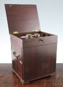 A Victorian mahogany apothecary chest, with hinged top and front and back doors, currently locked,