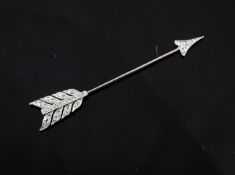 An Edwardian gold and diamond jabot pin, modelled as an arrow, set with rose cut diamonds, 2in.
