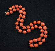 A single strand coral bead necklace, with gilt metal clasp, gross weight 48 grams, 19in.
