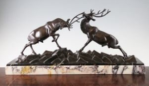 I. Rochard (French, 1906-1984). Fighting Stags, c.1930s, the patinated metal statuette group