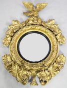 A Regency gilt wood and gesso girandole, with circular convex mirror, within a stiff leaf frame and
