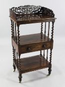 A Victorian rosewood three tier whatnot, with three quarter pierced gallery back and single central