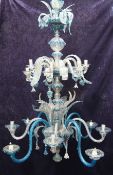 A large Venetian blue and clear glass two tier chandelier, with scrolling leaves and flower head