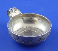 A mid 18th century French 950 standard silver taste vin by Michel Delapierre II, decorated with