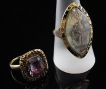A George III gold and black enamelled mourning ring, of marquise shape with panel decorated with a