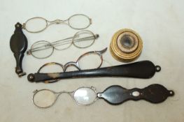 A 19th century gilt metal four draw spy glass, a pair of George III silver rimmed spectacles, marks