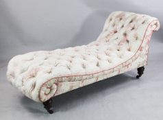 A Victorian Gillows scroll end settee, with cream and pink striped button upholstery, the turned