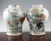 A pair of large Chinese famille verte baluster vases, 20th century, each painted with birds in