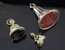 Three 19th century gold overlaid gem set fob seals, each with carved matrix, largest 1.75in.