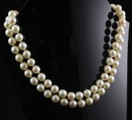 A double strand cultured pearl choker necklace with circular white gold, ruby, diamond and cultured