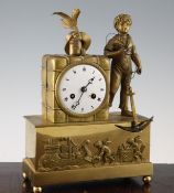 A French Empire ormolu mantel clock, modelled with a boy sailor standing beside a package, with