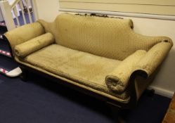 A George III style carved mahogany scroll end settee, with carved cabriole legs and claw feet, in
