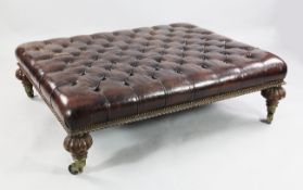 A large Victorian oak framed buttoned leather rectangular foot stool, the gadrooned turned supports