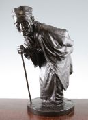 A large Japanese bronze figure of an elderly man, Meiji period, stooping and holding a walking