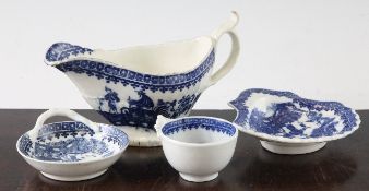 Four pieces of Caughley in the Pleasure Boat pattern, c.1780, comprising a small strainer with `