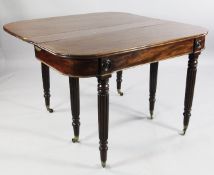 A 19th century mahogany extending dining table, the folding top with concertina action expanding to