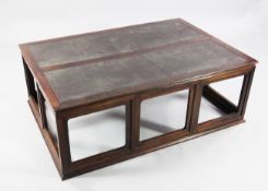 A 20th century Chinese Jichimu rectangular low table, the rectangular leather top with inset panels