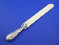 A late Victorian silver handled ivory page turner, the handle with engraved initials and embossed