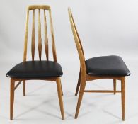 Niels Koefoed. A set of four Eva Danish teak dining chairs, with slat backs and black vinyl seats,