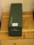 Two bottles of champagne including one Dom Perignon 1982, boxed, level 1 cm; and one Bollinger