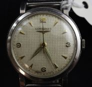 A gentleman`s early 1950`s stainless steel Longines manual wind wrist watch, with baton and