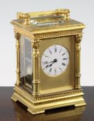 An early 20th century French gilt brass hour repeating carriage clock, with movement striking on a