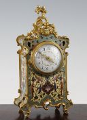 An early 20th century French ormolu and champleve mantel timepiece, with floral swag dial and eight