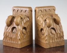 A pair of Robert `Mouseman` Thompson adzed oak triple mouse bookends, with carved mouse signatures,