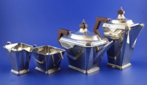 A stylish 1930`s Art Deco silver four piece tea set, of tapering rectangular form, with canted