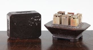 A Chinese soapstone set of eight seals and a stand, early 20th century, the tops of the seals