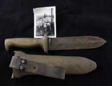 A C. E. Heinke & Co Ltd brass and steel diver`s knife, the blade with serrated edge, handle and