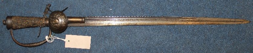 An 18th century combined sword and flintlock pistol, probably German, with fullered blade and