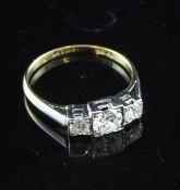 An 18ct gold and platinum, three stone diamond ring, with an estimated total diamond weight in