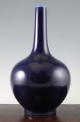 A Chinese cobalt blue glazed bottle vase, Kangxi mark but later, 39.5cm.