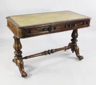 A Victorian mahogany library table, with gilt tooled leather inset top with three frieze drawers
