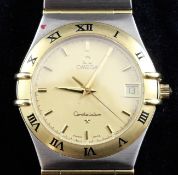 A gentleman`s 18ct gold and stainless steel Omega Constellation quartz wrist watch, the yellow dial