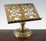 A late Victorian brass lectern, with pierced scrolling decoration, on circular base, 12in.