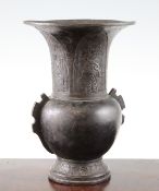 A Chinese bronze zhadou shaped vase, Ming dynasty, the trumpet shaped neck with four lappets relief