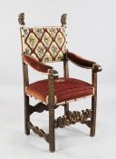 A 17th century style Italian walnut open armchair, with needlepoint back and seats, the upright