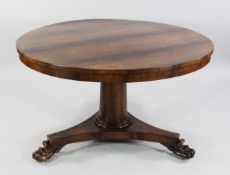 A William IV rosewood circular breakfast table, the flip top on central tapering column with