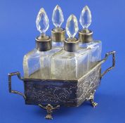 A late 19th/early 20th century French 950 standard silver two handled scent bottle stand with four