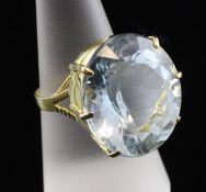 A 14ct gold and aquamarine dress ring, with large fancy cut oval aquamarine, size P.